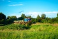 Train passing through forest and field