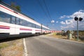 Train passing level crossing Royalty Free Stock Photo