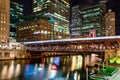 A train passing over the Chicago River through downtown at night. Main street in Chicago Royalty Free Stock Photo