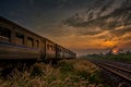 Train Passing by over Rural Railway in the Morning or at Dawn wi Royalty Free Stock Photo