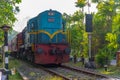 Train passing a railway crossing at Bentota, Sri Lanka
