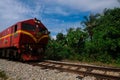 Train is passing by at a railway track in Manek Urai, Kelantan, Malaysia