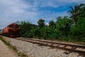 Train is passing by at a railway track in Manek Urai, Kelantan, Malaysia