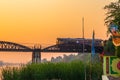 Train passing river Kwai bridge