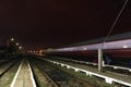 Train passing by a rural railway station in Romania