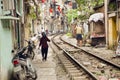 train passing through streets of hanoi slums, vietnam Royalty Free Stock Photo