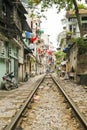 train passing through streets of hanoi slums, vietnam Royalty Free Stock Photo