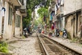 train passing through streets of hanoi slums, vietnam Royalty Free Stock Photo