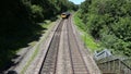 Train Passing Under Bridge