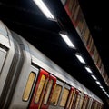 Train on the platform at Euston Square Underground Station, London UK, showing reflection of train on ceiling above. Royalty Free Stock Photo