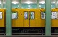 Train at the platform in the metro subway at Alexanderplatz U-Bahn station. Berlin, Germany. Royalty Free Stock Photo