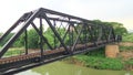 Train pratt truss steel bridge over Pasak river Thailand