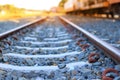 The train rails in the morning when the sun shines.