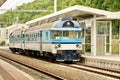 Train at the railway station. Blue train on the platform of the station. Royalty Free Stock Photo