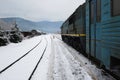 Train on the railway station in the Carpathian mountains in winter Royalty Free Stock Photo