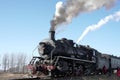 Train ready to leave, close up of steaming locomotive Royalty Free Stock Photo