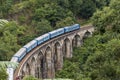 Train on Nine Arches bridge in hill country of Sri Lanka