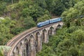 Train on Nine Arches bridge in hill country of Sri Lanka Royalty Free Stock Photo