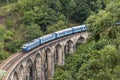 Train on Nine Arches bridge in hill country of Sri Lanka