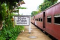 Train ride in Sri Lanka. Man hanging on a wagon Royalty Free Stock Photo