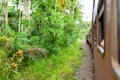 Train ride in Sri Lanka. Man hanging on a wagon Royalty Free Stock Photo