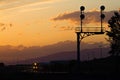 A train rolls through curves at sunset