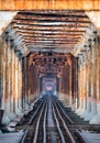 Train running on ancient railway on Long Bien bridge in Hanoi