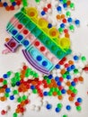 train-shaped pop-its in between colorful water gell balls