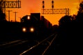 Train Silhouetted against Golden Sky Royalty Free Stock Photo