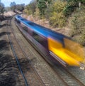 Train speeding through English countryside Royalty Free Stock Photo