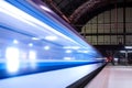 Train speeding through railway station with extended motion. Royalty Free Stock Photo