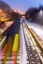 Train Speeding Through Snow Covered Station Royalty Free Stock Photo