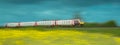 Train speeding through yellow fields