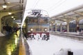 Stopped locomotive covered with snow at the end of the track 