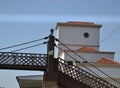 Old train station. Building with building named after the city and old wooden and iron pedestrian bridge with and part of the cove Royalty Free Stock Photo