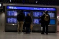 Train station terminal in Brussels Midi Station, passengers and travelers gather affront of info screen Royalty Free Stock Photo