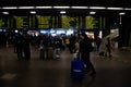 Train station terminal in Brussels Midi Station, passengers and travelers gather affront of info screen Royalty Free Stock Photo