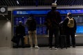 Train station terminal in Brussels Midi Station, passengers and travelers gather affront of info screen Royalty Free Stock Photo