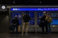 Train station terminal in Brussels Midi Station, passengers and travelers gather affront of info screen Royalty Free Stock Photo