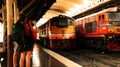 Train stations in Thailand have many tourists.