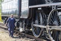 Train stoker and Steam locomotive  Aviemore Scotland Royalty Free Stock Photo