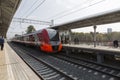 Train Swallow arrives at the passenger platform station Botanical Garden of the Moscow central ring Royalty Free Stock Photo