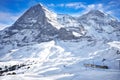 Train in swiss ski alpine mountain resort under Eiger peak, Grindelwald, Switzerland