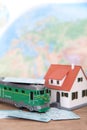 The train ticket home and the little green train and the little house Royalty Free Stock Photo