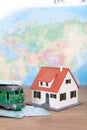 The train ticket home and the little green train and the little house Royalty Free Stock Photo