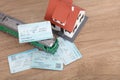 The train ticket home and the little green train and the little house Royalty Free Stock Photo