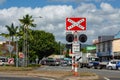 Train track crossing post sign on the road to Cairns from Port Douglas, Queensland, Australia Royalty Free Stock Photo
