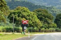 Train track crossing post sign on the road to Cairns from Port Douglas, Queensland, Australia Royalty Free Stock Photo