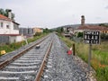 Train track at the exit of Monforte de Lemos towards Lugo and a sign next to the rails Royalty Free Stock Photo