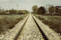 Train tracks with a bridge on the horizon Royalty Free Stock Photo